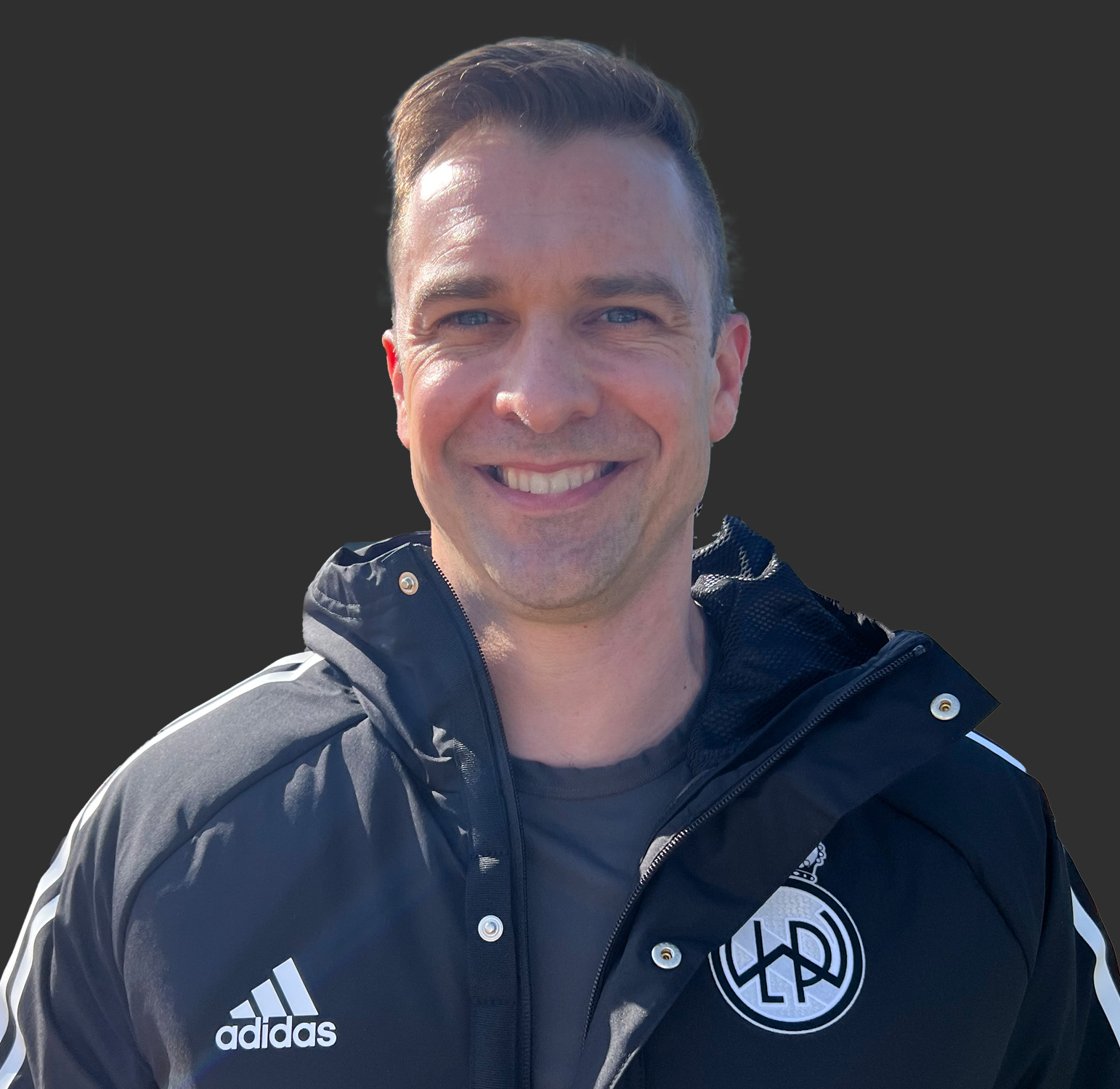 Thumbnail image of Kyle Richardson wearing a club Adidas jacket with club logo